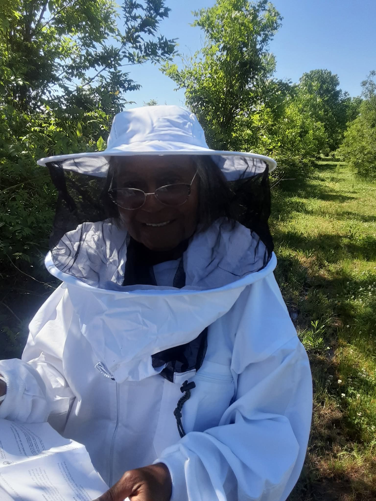 Farm founder Ernestine Young in beekeeping attire