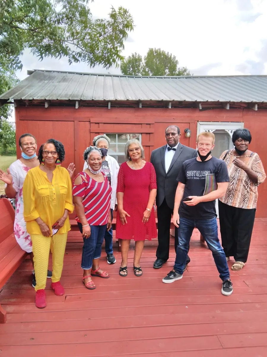 Group gathered on the red deck at Young Family Farm