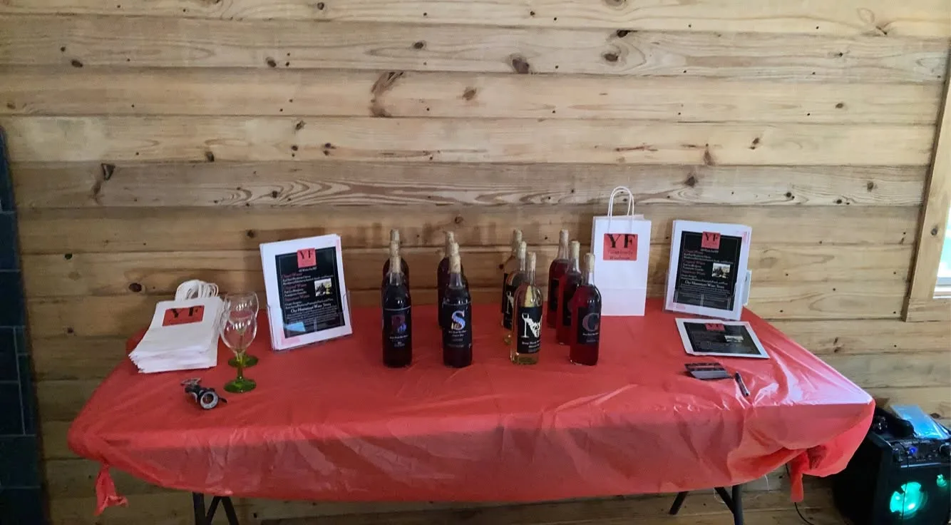 Winehouse bottle display and branded materials at a past gathering
